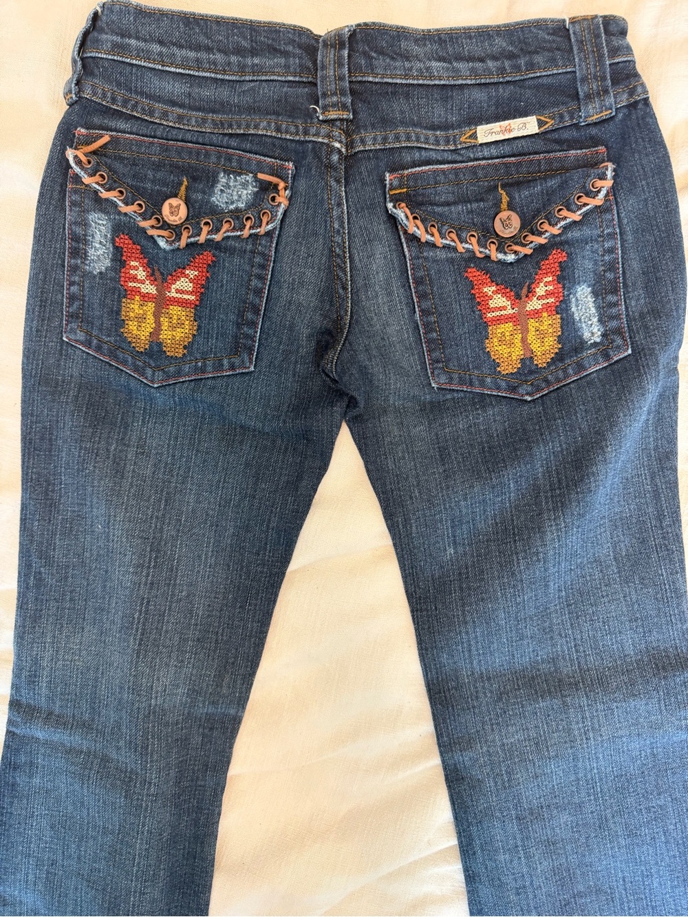 Frankie B. Dark Blue Jeans with Red and Yellow Butterfly Embroidery